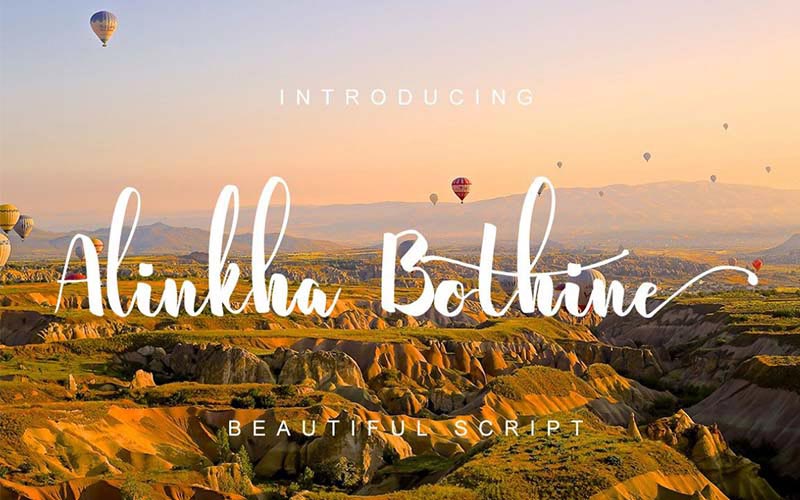 Alinkha Bothine font banner with grassland and hot air balloons in the background