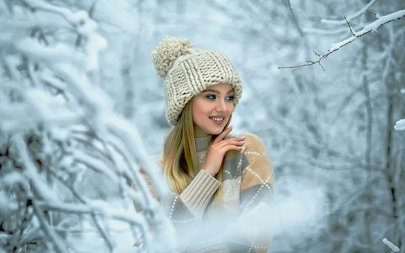 A Free Retro Photoshop Action Preview On An Image Of A Girl In Snow