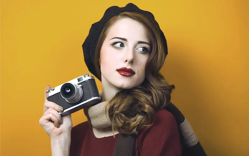 A PS Action Preview On An Image Of A Woman Posing With A Camera